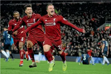  ??  ?? Liverpool’s Xherdan Shaqiri celebrates after scoring his side’s third goal in the 3-1 win over Manchester United at Anfield yesterday.