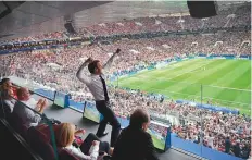  ?? AFP ?? French President Emmanuel Macron celebrates during the final against Croatia at the Luzhniki Stadium.