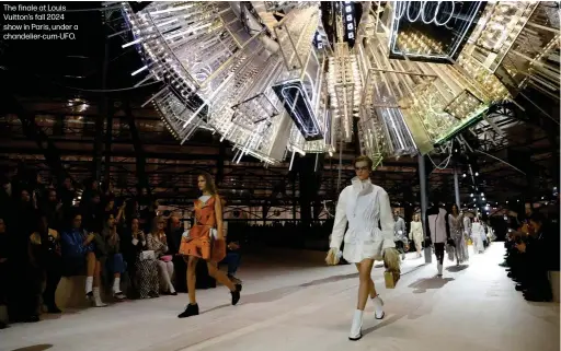  ?? ?? The finale at Louis Vuitton's fall 2024 show in Paris, under a chandelier-cum-UFO.