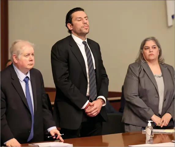  ?? MATT STONE — BOSTON HERALD ?? Flanked by attorney’s Gary Pelletier and Indy Sidhu, Boston Bruins forward Milan Lucic appears in Boston Municipal Court Friday where his case was dropped. The Bruins announced later he won’t return this season.