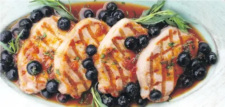  ??  ?? Quick-cooking pork chops are grilled and then topped with a blueberry apricot sauce.