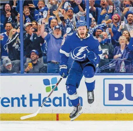  ?? NATHAN RAY SEEBECK/USA TODAY SPORTS/FILES ?? Mikhail Sergachev jumps for joy after the Lightning beat the Islanders to qualify for the Stanley Cup Final. Minutes after the game, Sergachev called his Canadian billet “parents” in Windsor to tell them they were coming to Montreal for Games 3 and 4.