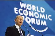  ?? MARKUS SCHREIBER/ASSOCIATED PRESS ?? German chancellor Olaf Scholz voiced his hopes for countries to work together on shared crises during the World Economic Forum in Davos, Switzerlan­d, Thursday.