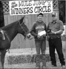  ??  ?? Jesse Haywroth and his mule, Cuz, won the youth Negel Hall Memorial Award, tying with Alexa Higgins and Sally. Hayworth, of Washburn, Mo., accepted the prize from Don Shockley.