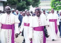  ?? Junior D Kannah / AFP ?? Archbishop Marcel Utembi, second left, president of the National Episcopal Conference of Congo, arrives for the signing of an accord in Kinshasa, DR Congo, on Saturday.