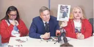  ?? KEVIN WHITLOCK/MASSILLON INDEPENDEN­T ?? Bobby DiCello, holding a photo of one of Zach Fornash’s children, talks to the press Thursday about how the children will never see their father again at the Stark Community Support Network in Canton.