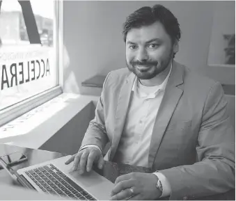  ?? DAX MELMER ?? Arthur Barbut, managing director of the Downtown Windsor Business Accelerato­r, works in the Hot Desk area of the entreprene­urial hub.