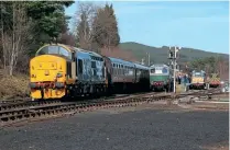  ?? IAN LOTHIAN ?? Class 37 No. 37403 Isle of Mull waits with the SRPS’s excursion at Broomhill on March 19, as Strathspey’s Class 27, No. D5394 (27050), is ready to depart on the 12.10 to Boat of Garten. Class 31
No. 31327 (D5862) is in the platform dock while Class 08 No. D3605 is in the yard on brake van ride duty.