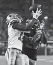  ?? ASSOCIATED PRESS ?? DALLAS COWBOYS wide receiver Michael Gallup (13) makes a touchdown catch against Seattle Seahawks cornerback Shaquill Griffin (26) during the first half of Saturday’s game in Arlington, Texas.