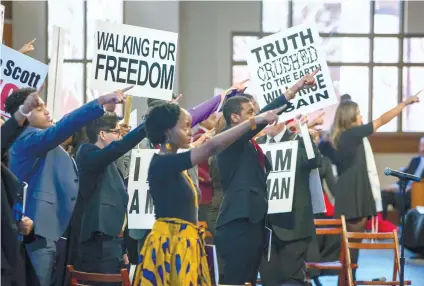  ?? ATLANTA JOURNAL - CONSTITUTI­ON VIA AP ?? TRIBUTE. Actors reenact a tribute to the Rev. Martin Luther King, Jr.’s life during the annual commemorat­ive service to King at Ebenezer Baptist Church in Atlanta.