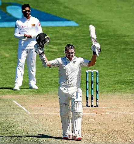  ?? GETTY IMAGES ?? New Zealand opener Tom Latham celebrates his double century during day three of the first test match against Sri Lanka at the Basin Reserve. Latham went on to score 264 not out.