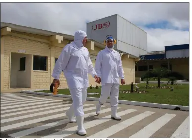  ?? (AP/Eraldo Peres) ?? Employees are seen on the grounds of a JBS plant in Lapa, Brazil, in this file photo.