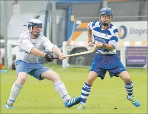  ?? Photograph by Donald Cameron. ?? Skye’s Ally MacDonald, left, and Iain Robinson of Newtonmore during Saturday’s Camanachd Cup tie which Newtonmore won 4-2.