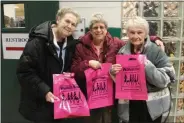  ??  ?? Left to right: Diana Houghton of Castleton, Linda Byer of East Greenbush, and Marilyn Parslow of Schodack, hold their pink New York Women’s Expo bags before entering the event.