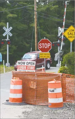  ?? H John Voorhees III / Hearst Connecticu­t Media ?? Improvemen­ts are being made Friday to the Long Ridge Road railroad crossing in Redding. Officials hope the work will be finished by fall.