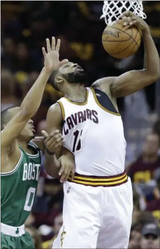  ?? TONY DEJAK — ASSOCIATED PRESS ?? Tristan Thompson grabs a rebound against the Celtics’ Avery Bradley during the first half of Game 3 of the Eastern Conference finals on May 21 at Quicken Loans Arena.