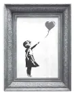  ?? SOTHEBY’S VIA AP ?? The spray-painted canvas “Girl with Balloon” by Banksy is seen. Art prankster Banksy has struck again. A work by the elusive street artist self-destructed in front of startled auction-goers Friday moments after being sold for $1.4 million.