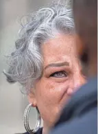  ?? JOSEPH SCHELLER/COLUMBUS DISPATCH ?? Rebecca Duran, Donovan Lewis’ mother, speaks with a reporter Sept. 30 during a press conference outside of the Ohio Statehouse.