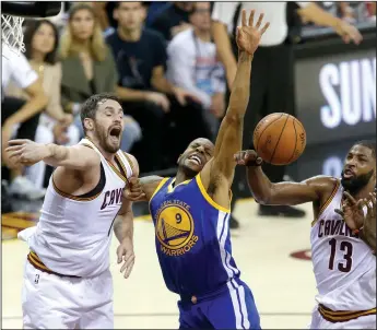  ?? PHIL MASTURZO/TRIBUNE NEWS SERVICE ?? The Cleveland Cavaliers' Kevin Love, left, and Tristan Thompson (13) tangle with the Golden State Warriors' Andre Iguodala (9) for a first-quarter rebound during Game 4 of the NBA Finals in Cleveland on Friday.