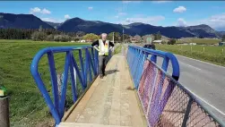  ??  ?? Above: WSP Designer, Peter Kortegast on the new footbridge beside SH60.