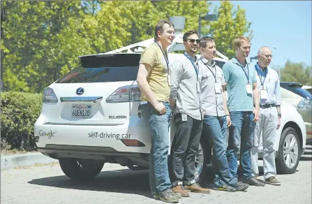  ?? ERIC RISBERG/AP PHOTO ?? Google team members pose last month by a self-driving car at the Computer History Museum in Mountain View, Calif. From left, project director Chris Urmson, Brian Torcellini, Dimitri Dolgov, Andrew Chatham and Ron Medford, the director of safety for the...