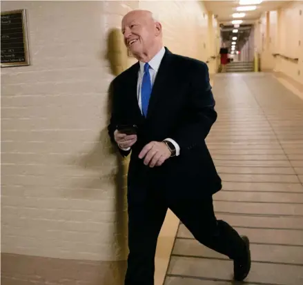  ?? (Photo by J. Scott Applewhite, AP) ?? House Ways and Means Committee Chairman Kevin Brady, R-Texas, steward of the GOP tax bill, smiles he as he arrives for a closeddoor meeting as the Republican majority in Congress prepares to vote on the biggest reshaping of the U.S. tax code in three...