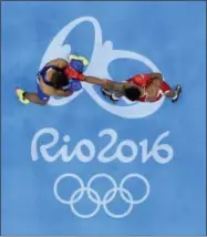  ?? FRANK FRANKLIN II - THE ASSOCIATED PRESS ?? FILE - In this Sunday, Aug. 21, 2016 file photo, France’s Tony Victor James Yoka, right, fights Britain’s Joe Joyce during a men’s super heavyweigh­t over 91-kg final boxing match at the 2016 Summer Olympics in Rio de Janeiro, Brazil. The embattled amateur boxing federation faces an Olympic inquiry on Monday May 20, 2019 fearing it could be punished for forcing out a longtime IOC member as its president.