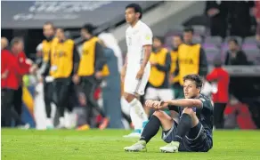  ?? Picture / Getty Images ?? Darren White and Auckland City were left dejected yesterday.
