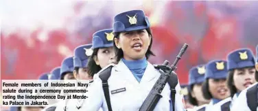  ??  ?? Female members of Indonesian Navy salute during a ceremony commemorat­ing the Independen­ce Day at Merdeka Palace in Jakarta.