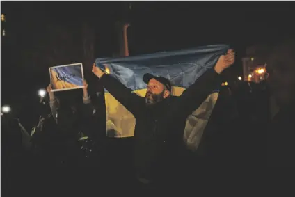  ?? BERNAT ARMANGUE/AP ?? UKRAINIANS GATHER IN CENTRAL KYIV TO CELEBRATE the recapturin­g of Kherson city, Ukraine, on Friday.