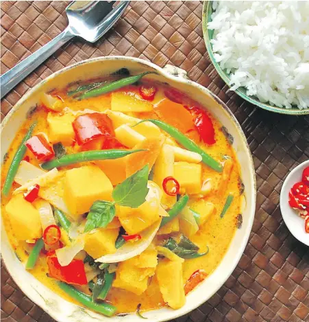  ?? ERIC AKIS ?? B.C. squash, a vegetable that’s currently in season, anchors this flavourful, coconut milk-based curry, rich with other vegetables. Soak up the sauce with aromatic Coconut Jasmine Rice.