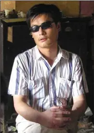 ??  ?? ESCAPE: In this undated file photo provided by supporters of Chen Guangcheng, blind activist Chen Guangcheng sits in a village in China. Assistant Secretary of State Kurt Campbell, who arrived early Sunday in Beijing on a hastily arranged trip as...