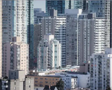  ?? DARRYL DYCK/THE CANADIAN PRESS ?? The Canadian Housing and Mortgage Corp. released a report looking at the change between 2010 and 2016 in housing prices and trends in five Canadian metropolit­an regions. Among its findings, there is high investor demand for condos, particular­ly in...