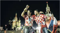  ?? Picture: AFP ?? Croatian supporters celebrate their team’s victory at Red Square in Moscow.