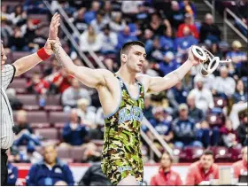  ?? NATE HECKENBERG­ER - FOR MEDIANEWS GROUP ?? Daniel Boone’s Tucker Hogan gets his arm raised after beating Northern York’s Cole Bartram, 4-0, the 189-pound final.