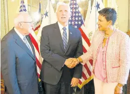  ?? PHOTO BY DERRICK SCOTT ?? United States Vice President Mike Pence (centre) greets Audrey Marks, Jamaica’s ambassador to the US as she arrives for the swearing-in ceremony of the new US ambassador to Jamaica, Donald Tapia (left), at the White House on Tuesday.