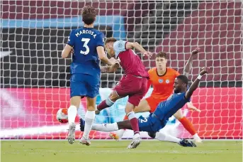  ??  ?? Striker Andriy Yarmolenko scores West Ham United’s third goal — the winner — against Chelsea during their English Premier League match at The London Stadium in east London on Wednesday. The Hammers scored an upset 3-2 victory. — Reuters