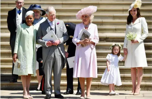  ??  ?? ABOVE: Doria Ragland, Prince Charles, the Duchess of Cornwall, Princess Charlotte and the Duchess of Cambridge. BELOW LEFT: The Queen and Prince Philip. BELOW RIGHT: The long-awaited first kiss as a married couple.