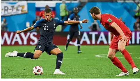  ?? — AFP ?? Taking his chances: France forward Kylian Mbappe (left) attempts to score as Belgium defender Jan Vertonghen tries to defend during the semi-finals at the St Petersburg Stadium on Tuesday.