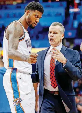  ?? [PHOTO BY NATE BILLINGS, THE OKLAHOMAN] ?? Oklahoma City’s Paul George, left, is excited that coach Billy Donovan’s contract is guaranteed for another year. Donovan is in his fourth season with the Thunder.