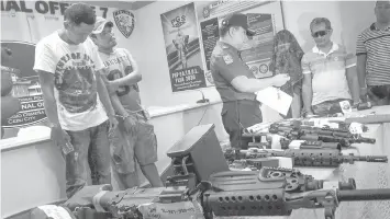  ??  ?? Leodegreco "Greco" Sanchez (right, with sunglasses), his wife Maricel Gregory, and farmhands Jolbert Jacaba and Glenn Nacion are presented to the media after their arrest last July in Tuburan town, Cebu.