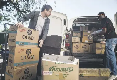  ?? Picture: Jacques Nelles ?? NO MORE HUNGER. Tuks FM sales manager Tony Graham, above left and on right, offloads groceries and other supplies sponsored by the Menlyn Park Shopping Centre yesterday for the 10 000 University of Pretoria students who form part of the missing middle.