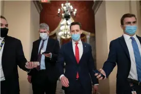  ??  ?? Josh Hawley walks to the House chamber to challenge the presidenti­al election results on 6 January. Photograph: J Scott Applewhite/AP