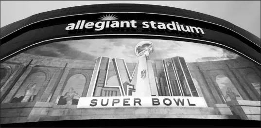  ?? ADAM HUNGER / ASSOCIATED PRESS ?? The exterior of Allegiant Stadium displays a Super Bowl 58 logo Monday in Las Vegas. Allegiant Airlines, which purchased the naming rights to the football stadium, says it is reaping millions in publicity because of events like the Super Bowl.