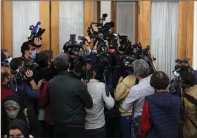  ?? ?? Journalist­s try to enter the room where Internatio­nal Atomic Energy Agency chief Rafael Mariano Grossi and Iranian Foreign Minister Hossein Amirabdoll­ahian were meeting Tuesday in Tehran. (AP/Vahid Salemi)