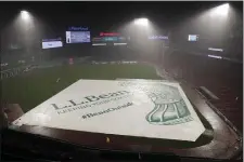  ?? MICHAEL DWYER — THE ASSOCIATED PRESS ?? Fenway Park is viewed after the baseball game between the Boston Red Sox and the New York Mets was suspended due to rain Friday, July 21, 2023, in Boston. The game will resume at 2:10 p.m Saturday.