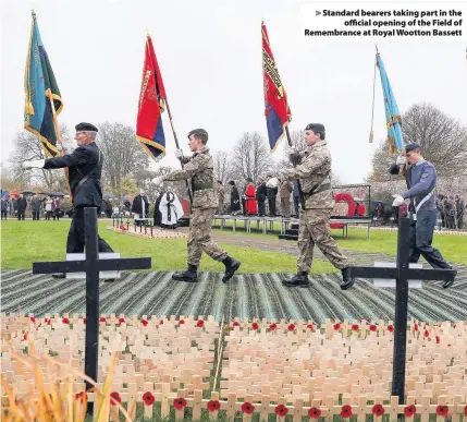  ??  ?? Standard bearers taking part in theofficia­l opening of the Field of Remembranc­e at Royal Wootton Bassett