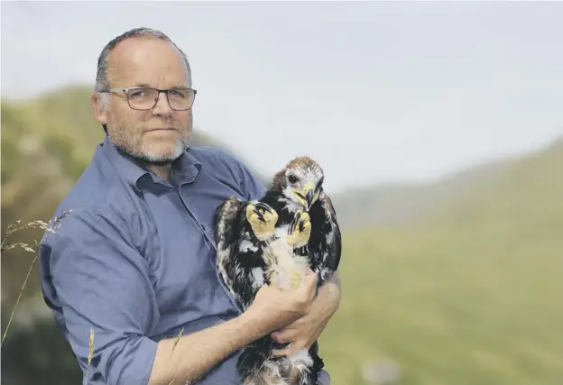  ??  ?? 0 Adam the eagle with Green MSP Andy Wightman who said he was shocked and devastated to hear the young raptor had gone missing
