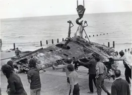  ?? ?? ■ The recovered wings and centresect­ion of a Messerschm­itt 109 E-4 are brought ashore at Hythe Redoubt, Kent, by the Brenzett Aeronautic­al Museum team in 1976. The aircraft was subsequent­ly identified as Werk Nummer 4853 of 2./JG51 which had been shot down on 7 October 1940. Its pilot, Leutnant Erich Meyer, was rescued from the sea and taken POW.