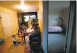  ?? KARL MONDON/STAFF ?? Ana Navarro, who works as the night shift janitor at Stanford University, watches her 3-year-old son inside her 450-square-foot apartment in Alviso.